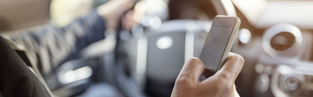 A man texting while driving